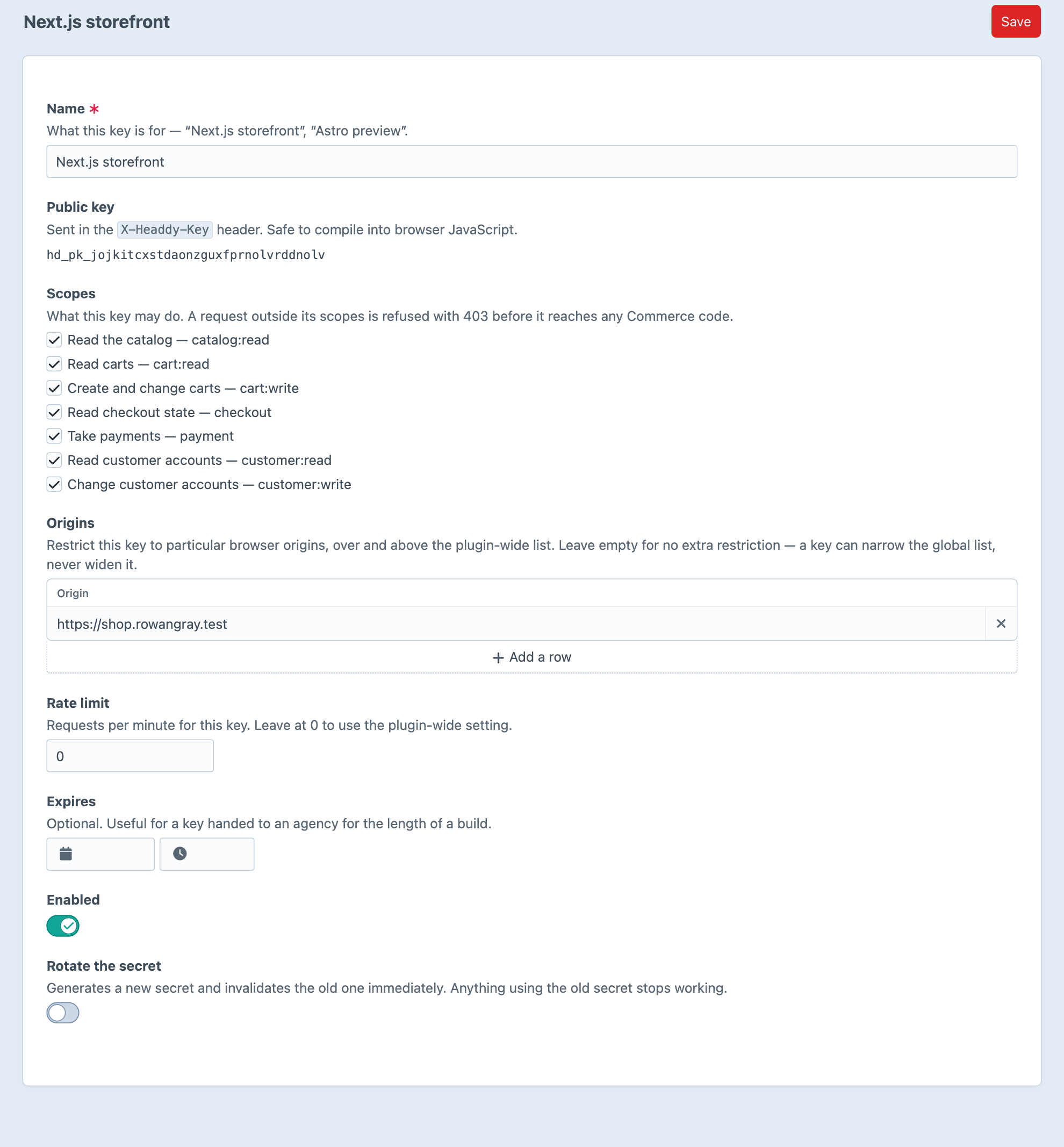 Editing the Next.js storefront API key in Headdy: its public key, seven scopes, an origin restriction, a rate limit, an optional expiry and a switch to rotate the secret